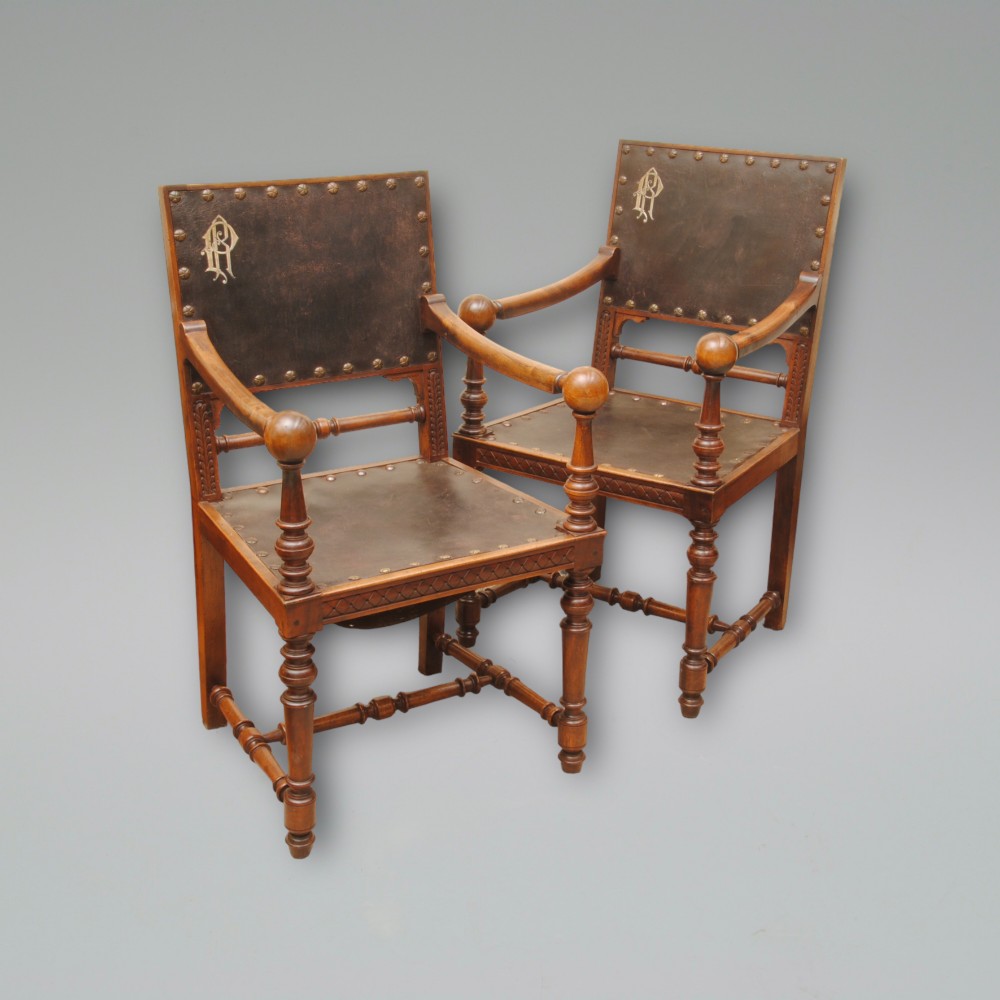 A PAIR OF 19TH CENTURY WALNUT ARMCHAIRS