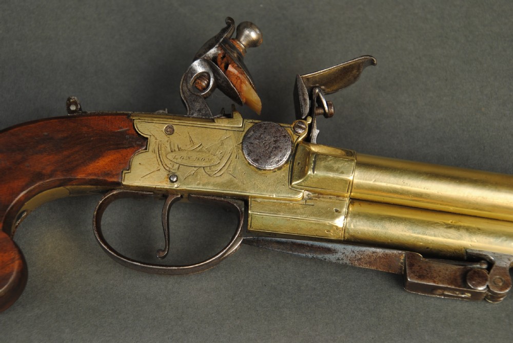 A TRIPLE BARREL BRASS BOXLOCK PISTOL WITH BAYONET BY BASS View V