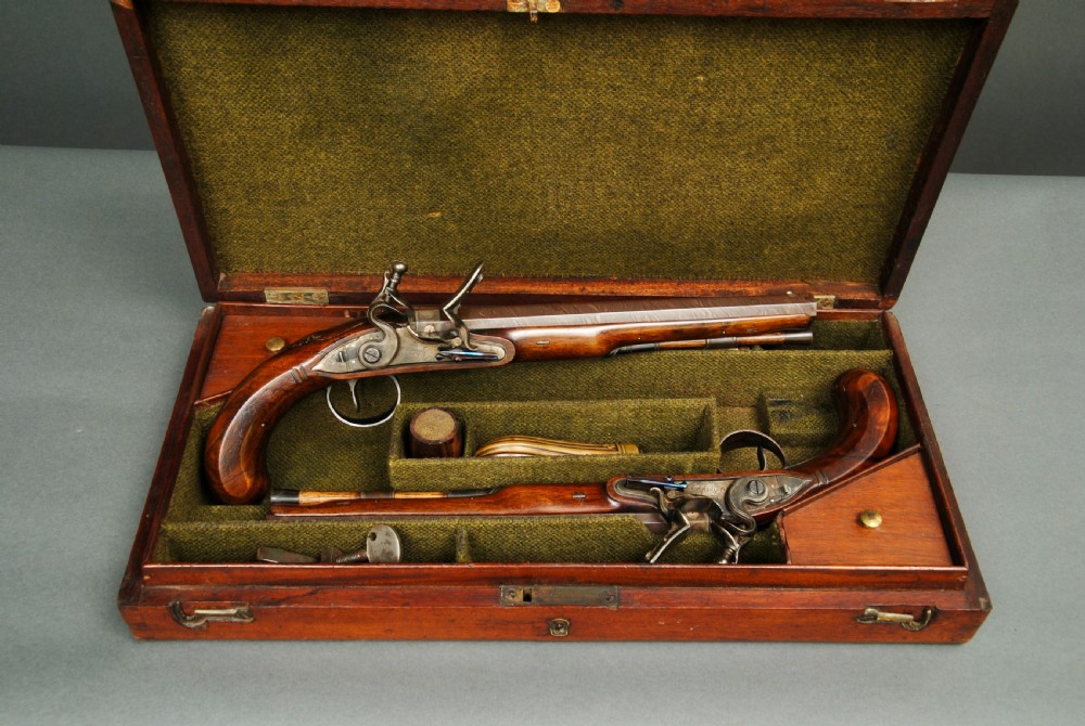 A FINE CASED PAIR OF FLINTLOCK PISTOLS BY TWIGG