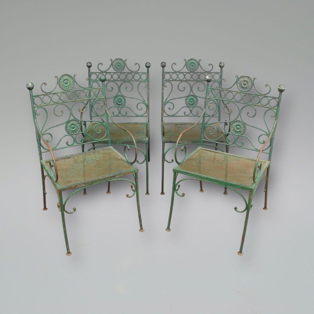 A SET OF FOUR MID 20TH CENTURY FRENCH METAL GARDEN CHAIRS