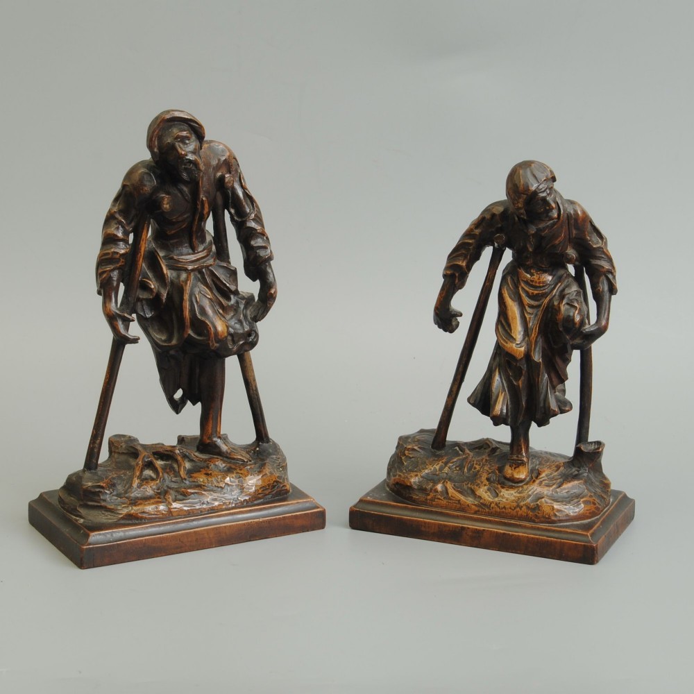 A PAIR OF FINELY CARVED BOX WOOD FIGURES OF BEGGARS