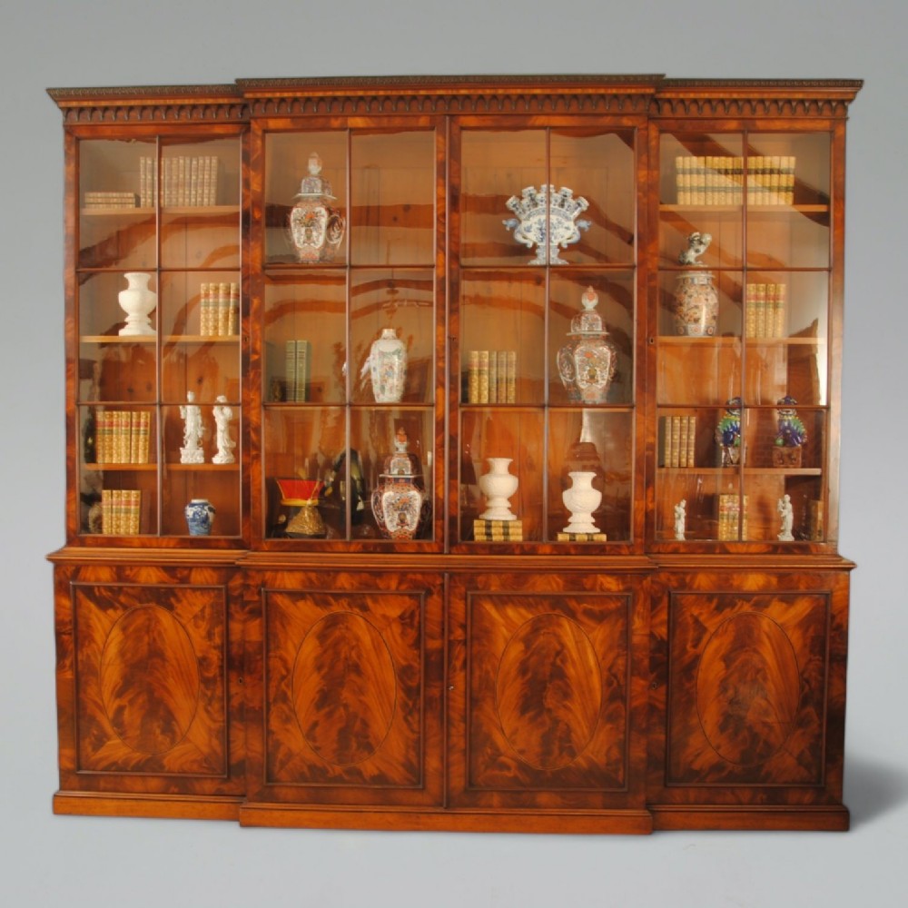 GEORGE III PERIOD FLAME MAHOGANY BREAKFRONT BOOKCASE