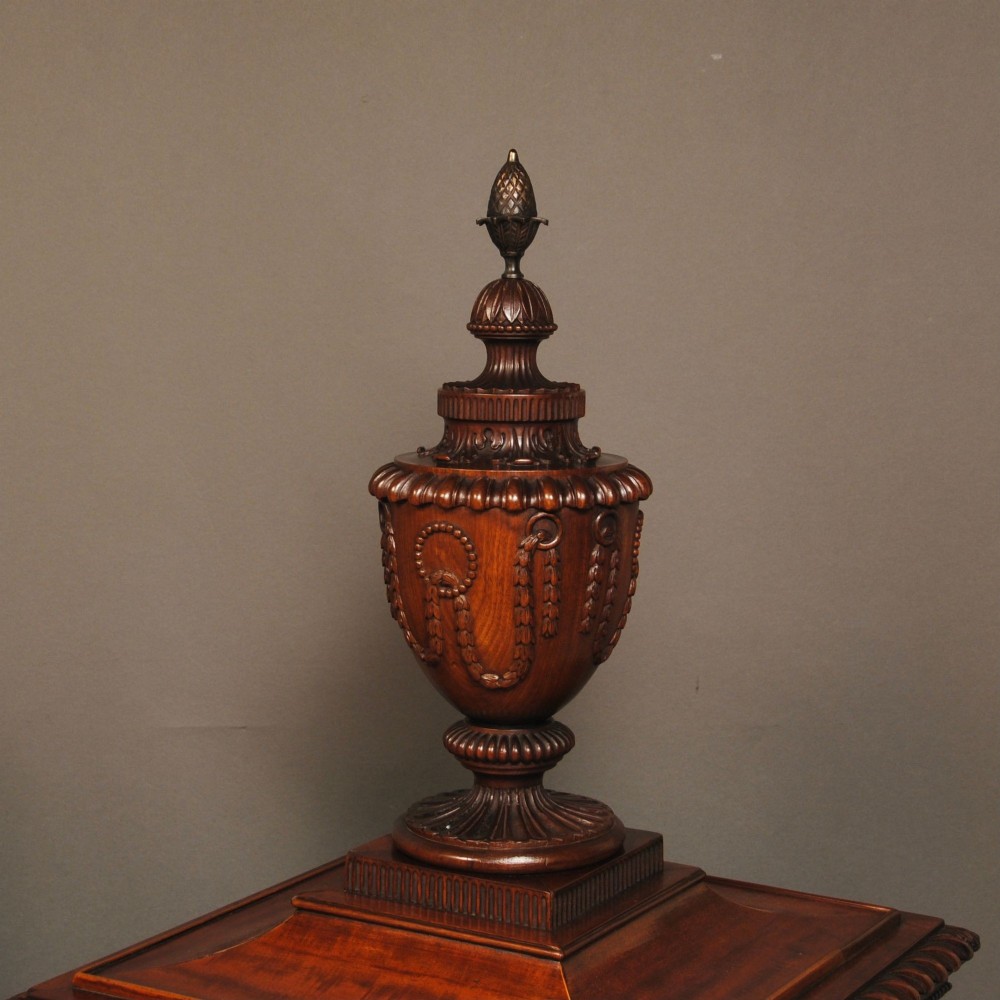 A pair of 18th-century mahogany dining pedestals featuring fluted square bodies, moulded bases, and detailed carved urn finials. View IV
