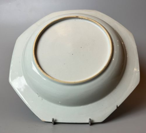 fig 2. A late 18th-century Chinese export porcelain plate featuring hand-painted cobalt blue river landscapes, pagodas, and a patterned border on a white background.