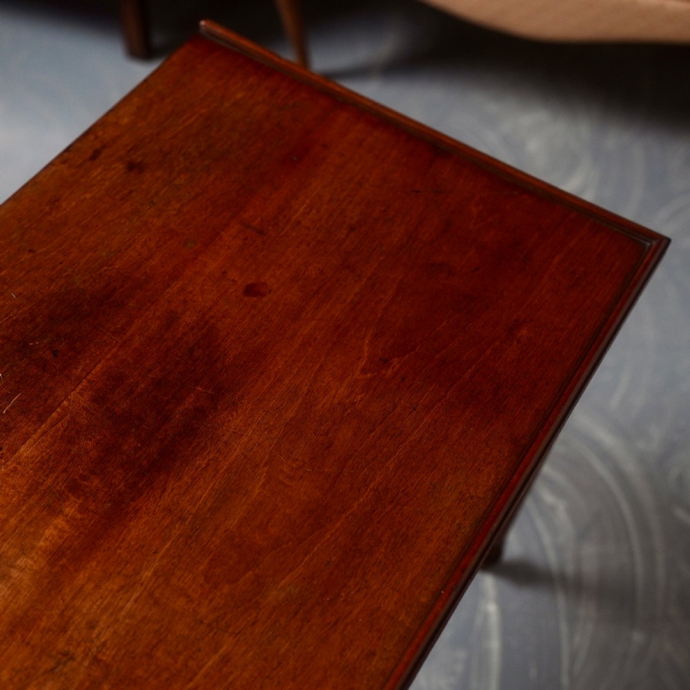 A 19th-century mahogany writing table featuring a single long drawer with turned wooden knobs and slender turned legs. View II