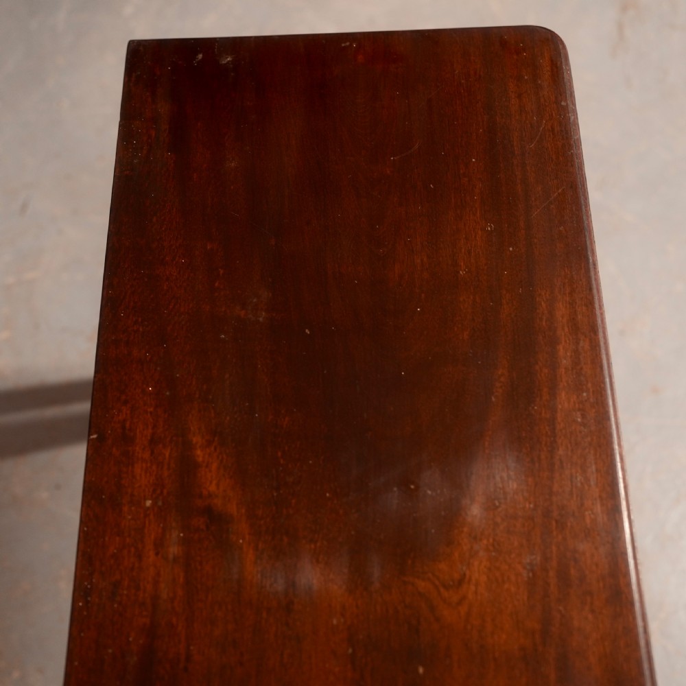 An 18th-century dark mahogany writing table featuring a single drawer with a brass handle plate and slender legs. View IV