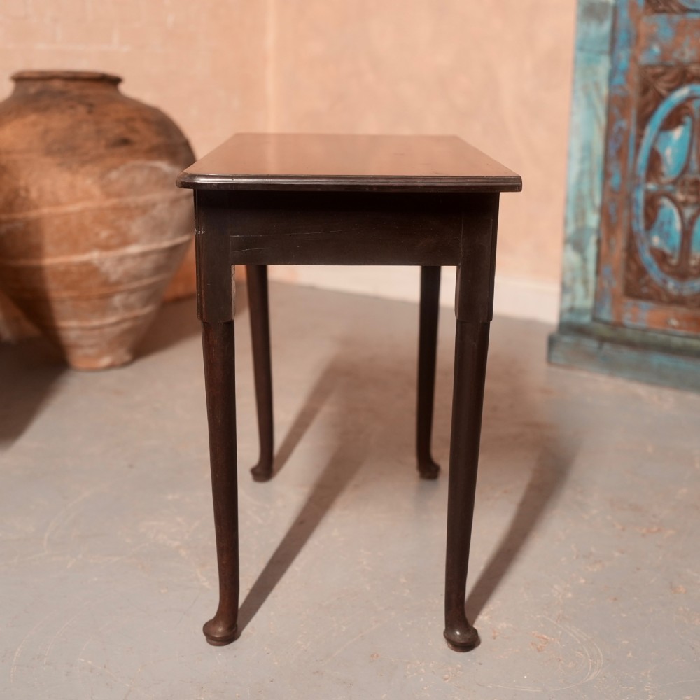 An 18th-century dark mahogany writing table featuring a single drawer with a brass handle plate and slender legs. View VIII