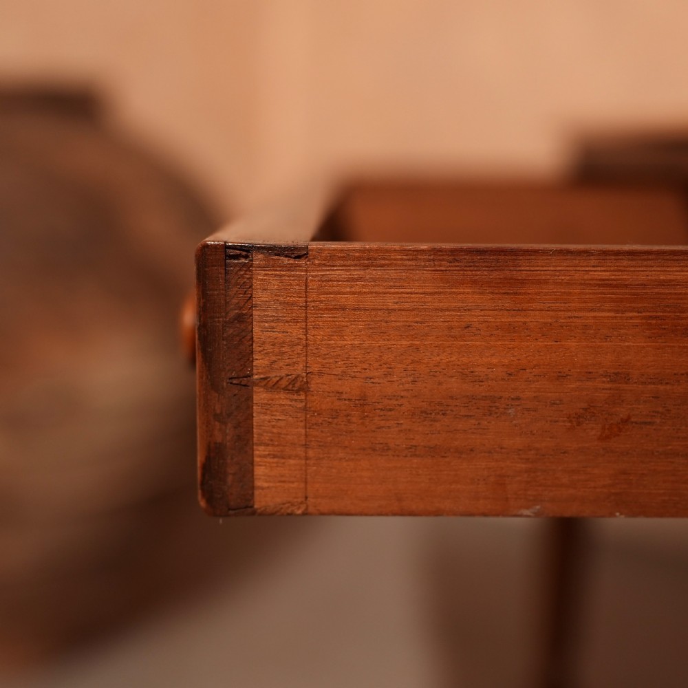 A William IV mahogany writing table featuring a raised gallery top, two frieze drawers with wooden knob handles, and reeded turned legs with brass castors. View X