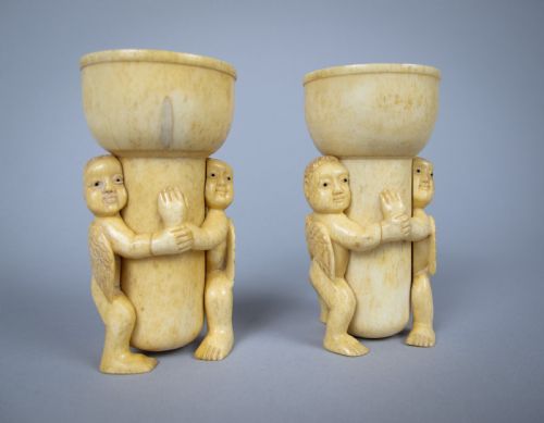 Unusual Pair of 19th Century Carved Bone Cherub Candle Holders.