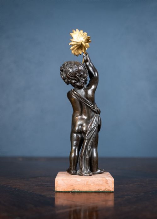 19TH CENTURY BRONZE PUTTO HOLDING A FLOWER - ADDITIONAL PHOTO 4