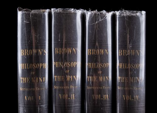 fig 1. A complete four-volume set of 1846 antique books titled Browns Philosophy of the Mind with gilt lettering on dark grey spines.