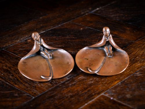 Pair of Art Nouveau Bronze 'Child in Leaf' Dishes