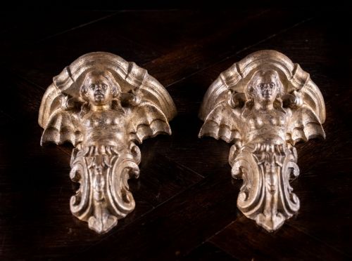 fig 3. A pair of late Victorian gilt terracotta wall brackets shaped as winged sirens with decorative acanthus scrollwork bases.