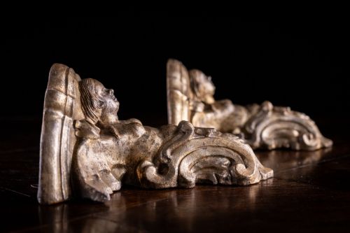 fig 7. A pair of late Victorian gilt terracotta wall brackets shaped as winged sirens with decorative acanthus scrollwork bases.