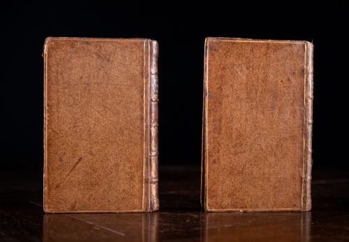 fig 3. A two-volume set of 18th-century leather-bound books featuring gilt-tooled spine details and raised bands standing vertically.