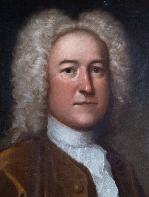 fig 1. An early eighteenth-century oil portrait of a gentleman in a wig and brown coat with his hand resting on a skull.