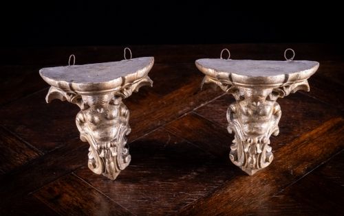 fig 7. A pair of late nineteenth-century gilt terracotta wall brackets featuring winged siren figures above acanthus scrollwork pedestals.