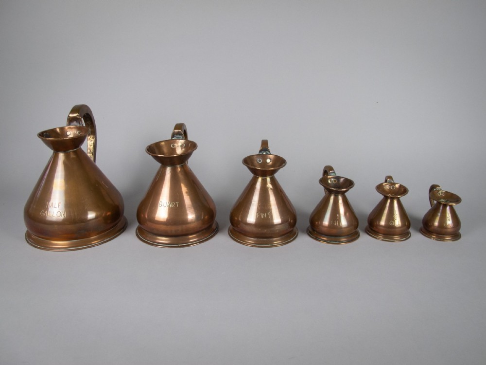 Six Graduated Vintage Copper Imperial Measuring Jugs. View III