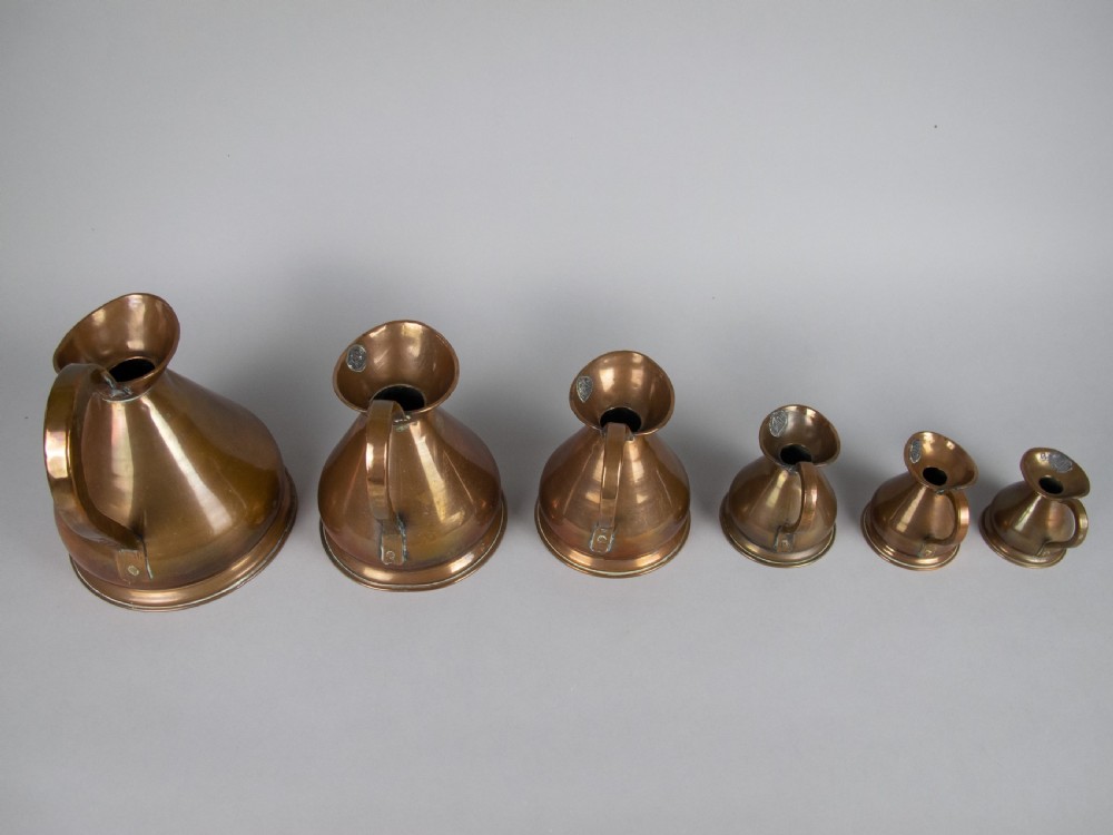 Six Graduated Vintage Copper Imperial Measuring Jugs. View V