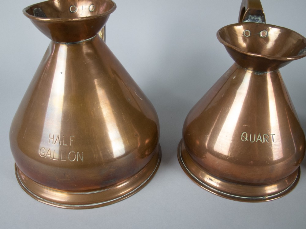Six Graduated Vintage Copper Imperial Measuring Jugs. View VI