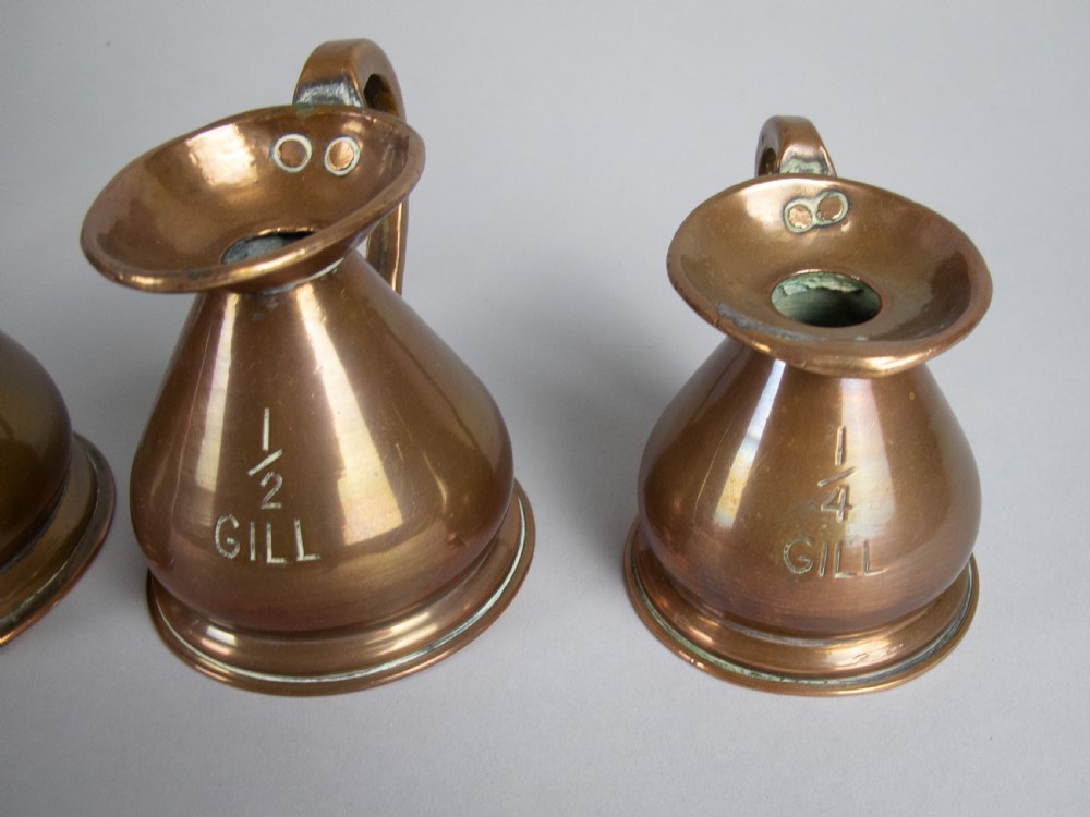 Six Graduated Vintage Copper Imperial Measuring Jugs. View VIII