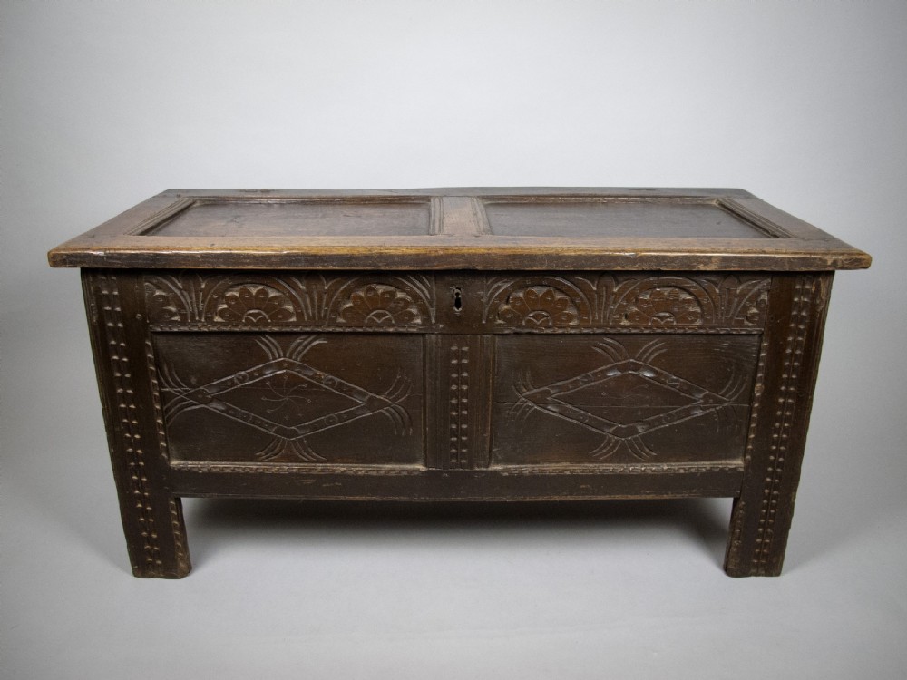 17th Century Carved Oak Coffer With Raised Legs & Original Iron Loop Hinges. View II
