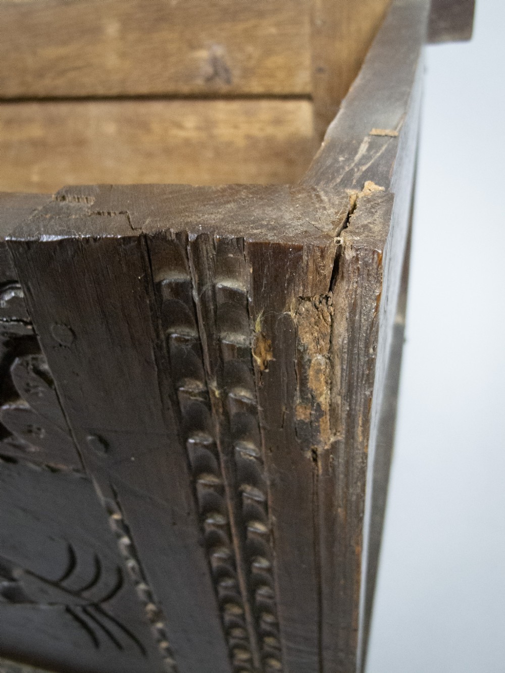 17th Century Carved Oak Coffer With Raised Legs & Original Iron Loop Hinges. View XII