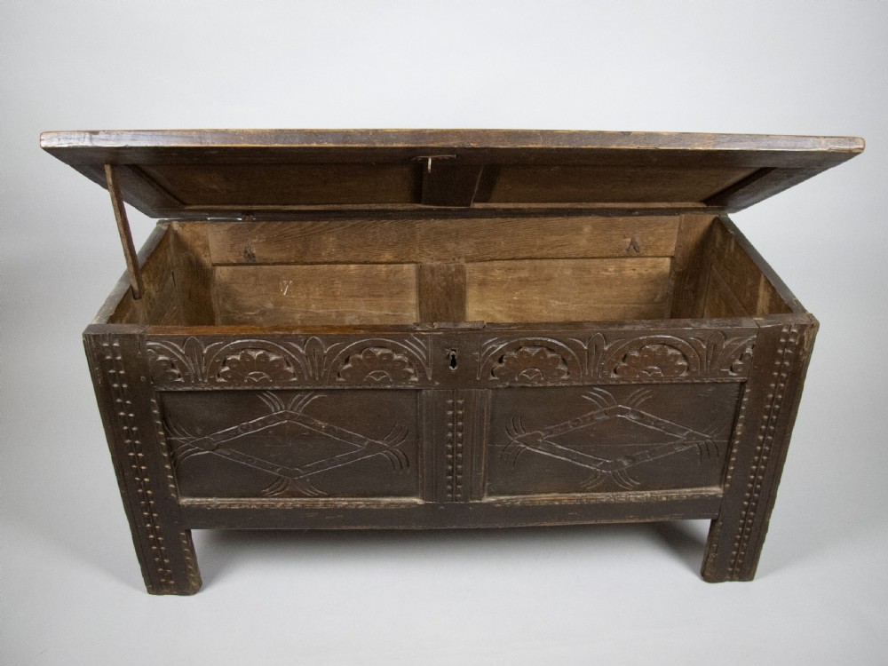 17th Century Carved Oak Coffer With Raised Legs & Original Iron Loop Hinges. View XV