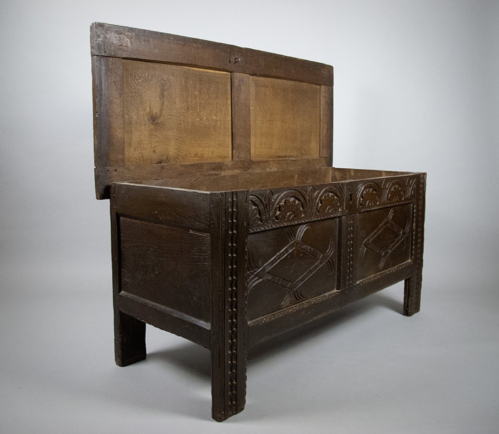 17th Century Carved Oak Coffer With Raised Legs & Original Iron Loop Hinges. View XVII