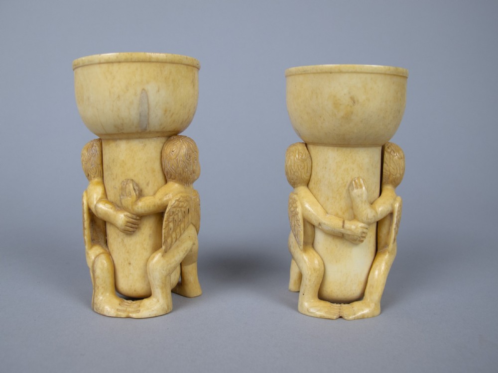 Unusual Pair of 19th Century Carved Bone Cherub Candle Holders. View IV