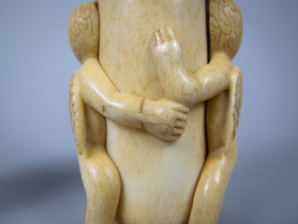 Unusual Pair of 19th Century Carved Bone Cherub Candle Holders. View VII