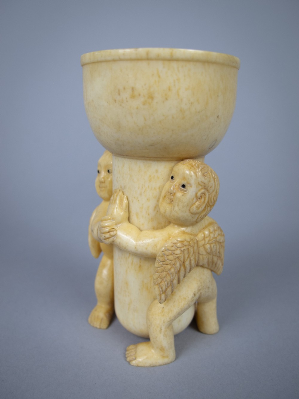 Unusual Pair of 19th Century Carved Bone Cherub Candle Holders. View VIII