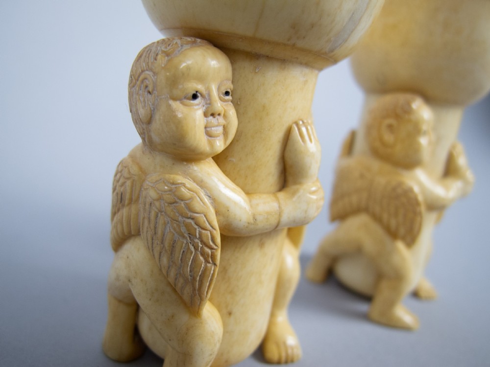 Unusual Pair of 19th Century Carved Bone Cherub Candle Holders. View IX