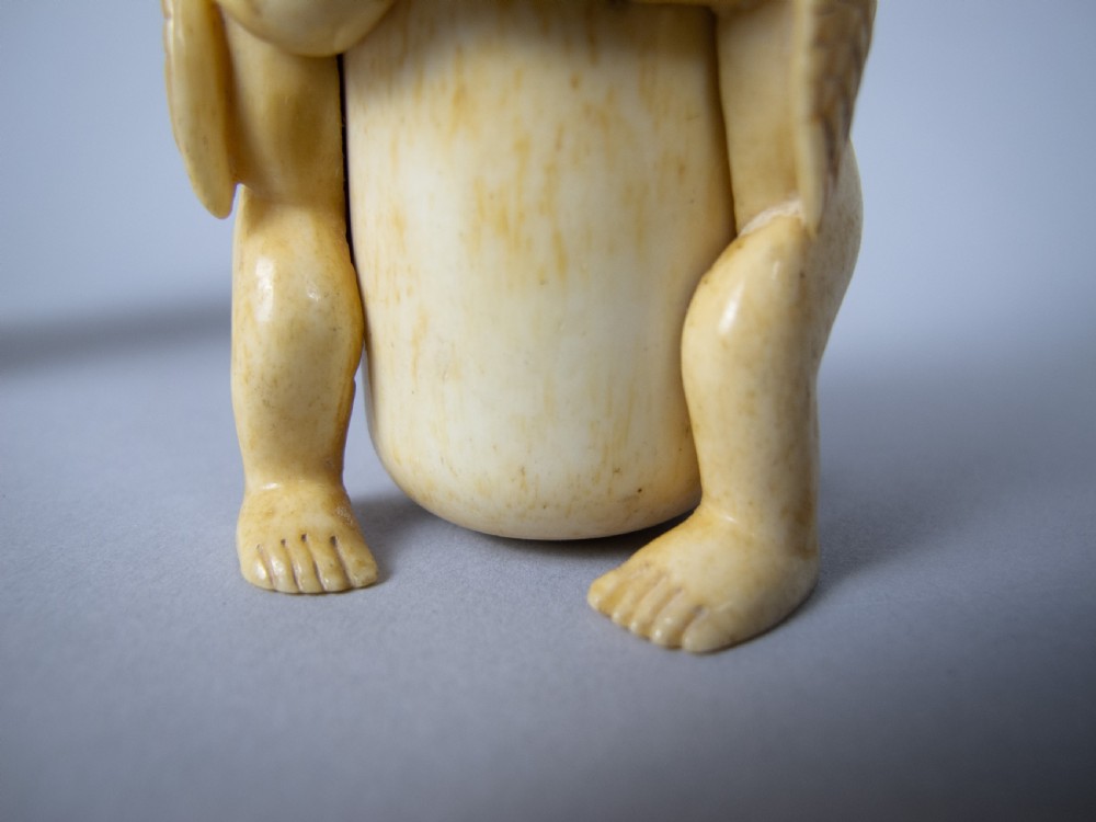 Unusual Pair of 19th Century Carved Bone Cherub Candle Holders. View X