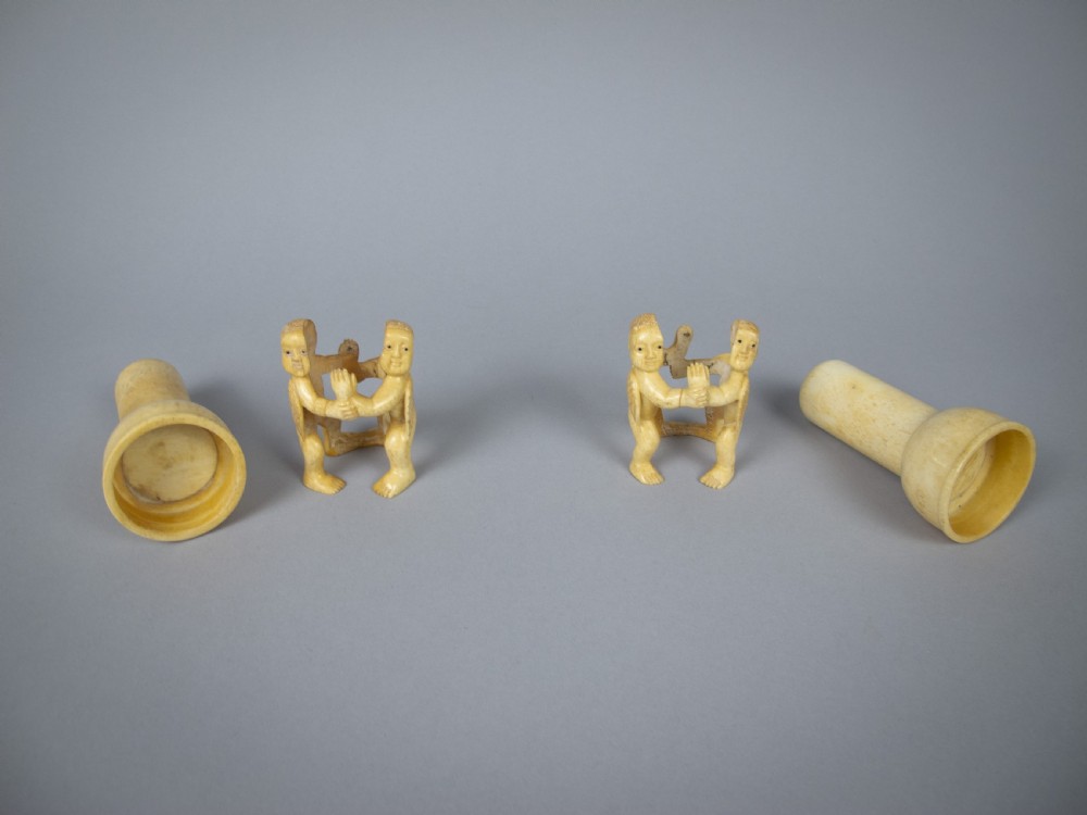 Unusual Pair of 19th Century Carved Bone Cherub Candle Holders. View XII
