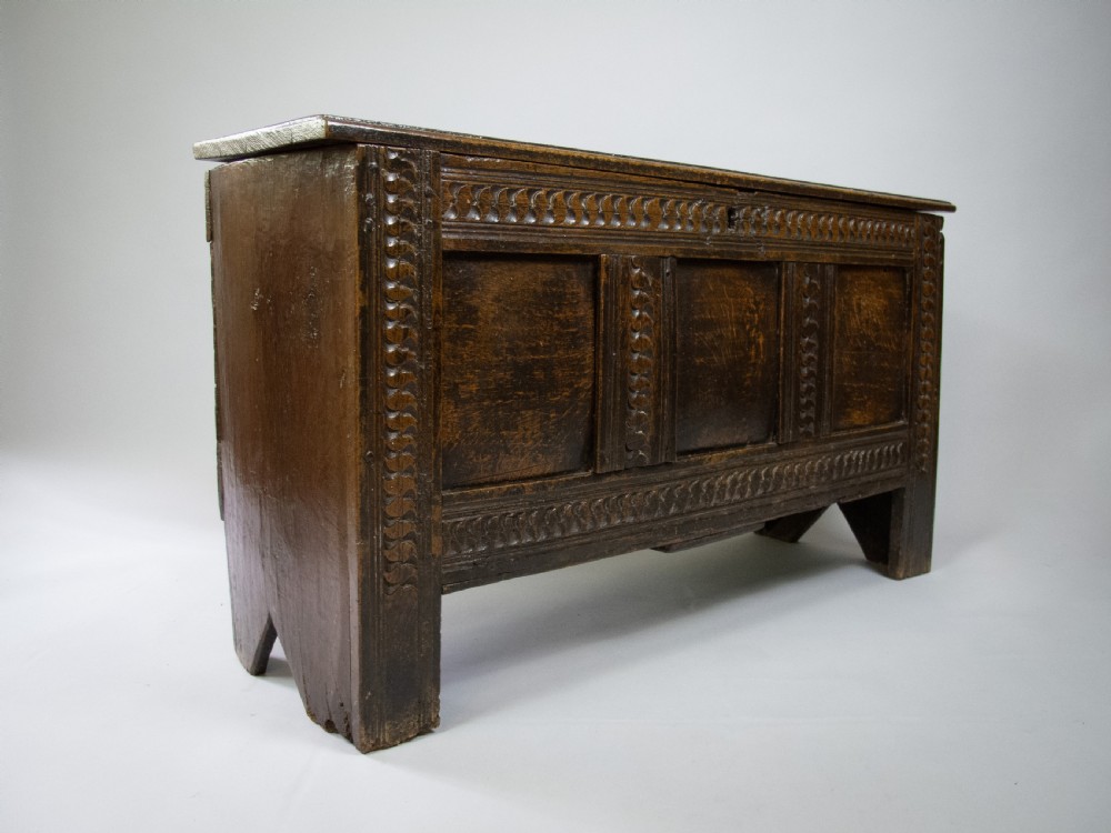 17th Century Oak Plank Coffer With Carved Triple Panel Front.