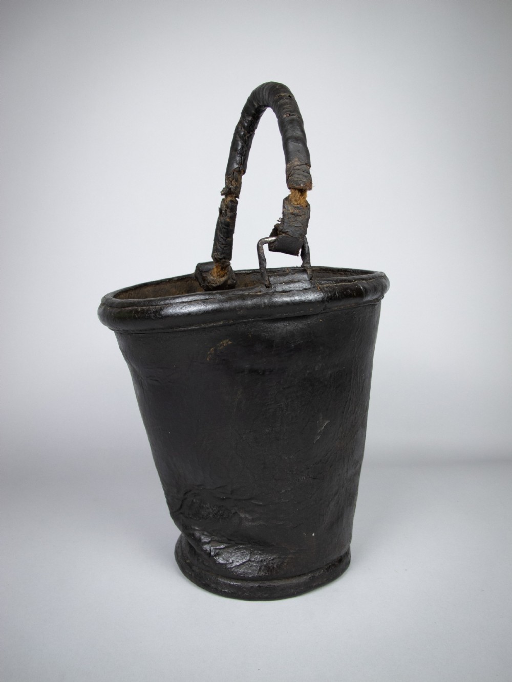 Sculptural George III Black Leather Fire Bucket, c.1790.