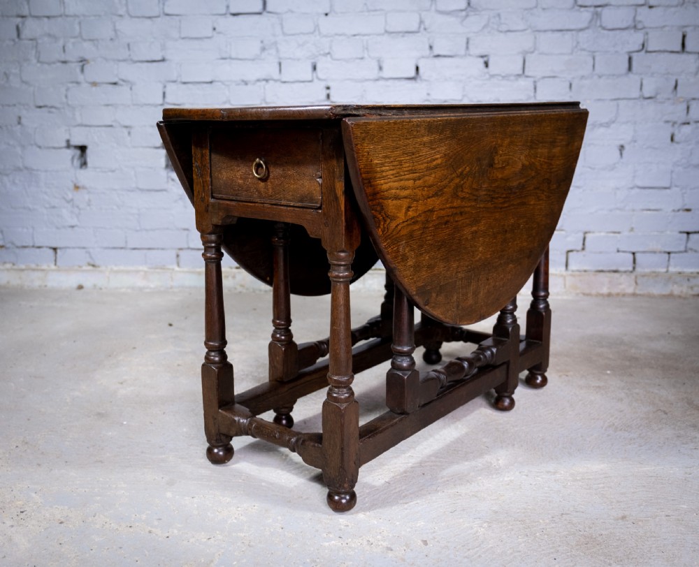 Early 18th Century English Oak Gate Leg Table With Central Drawer. View II