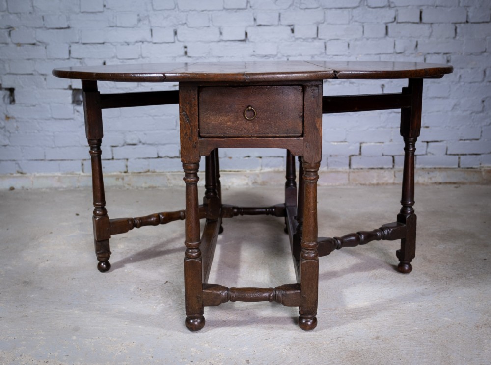 Early 18th Century English Oak Gate Leg Table With Central Drawer. View III