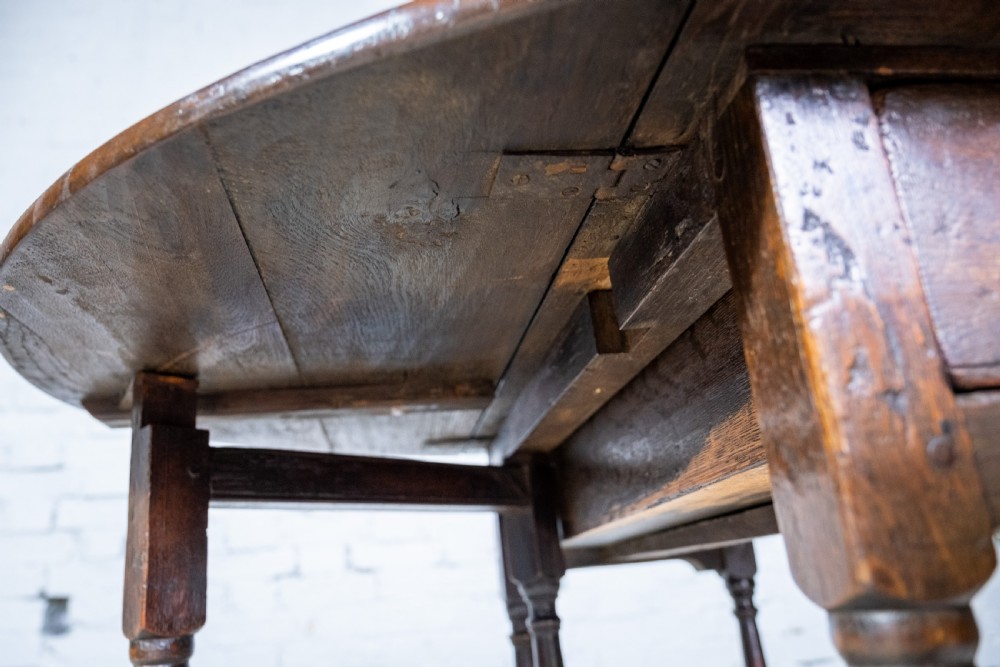 Early 18th Century English Oak Gate Leg Table With Central Drawer. View XII