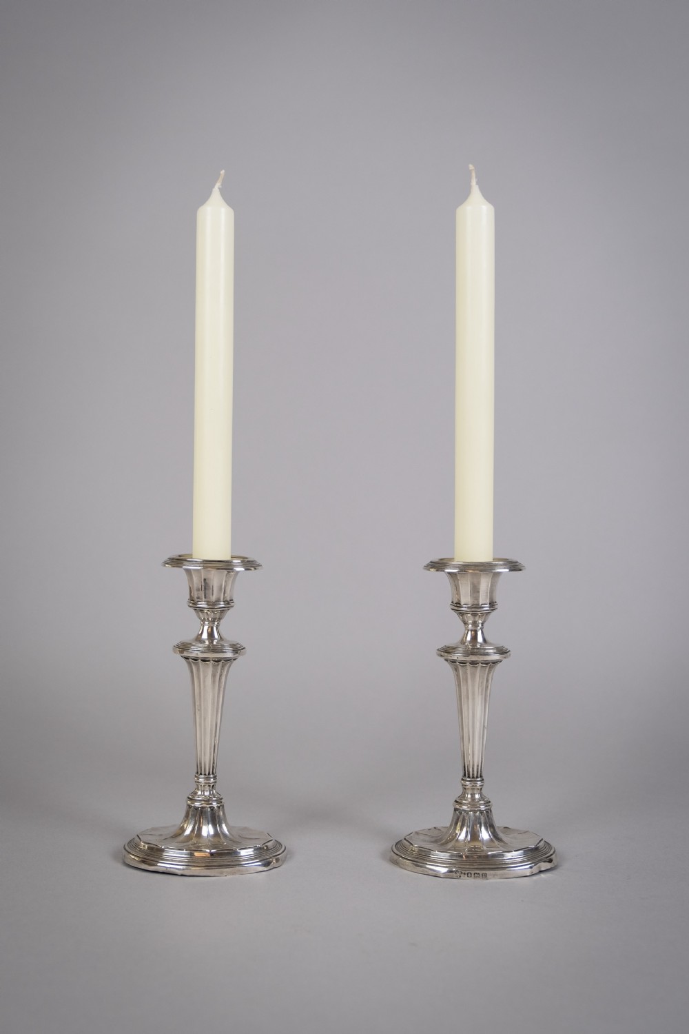 Pair Of Sterling Silver Neoclassical Candlesticks by Charles Boyton & Sons, 1911.