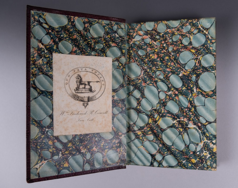 A three-volume set of 1835 leather-bound books by Alexander Pope with dark spine labels and gilt lettering. View VIII