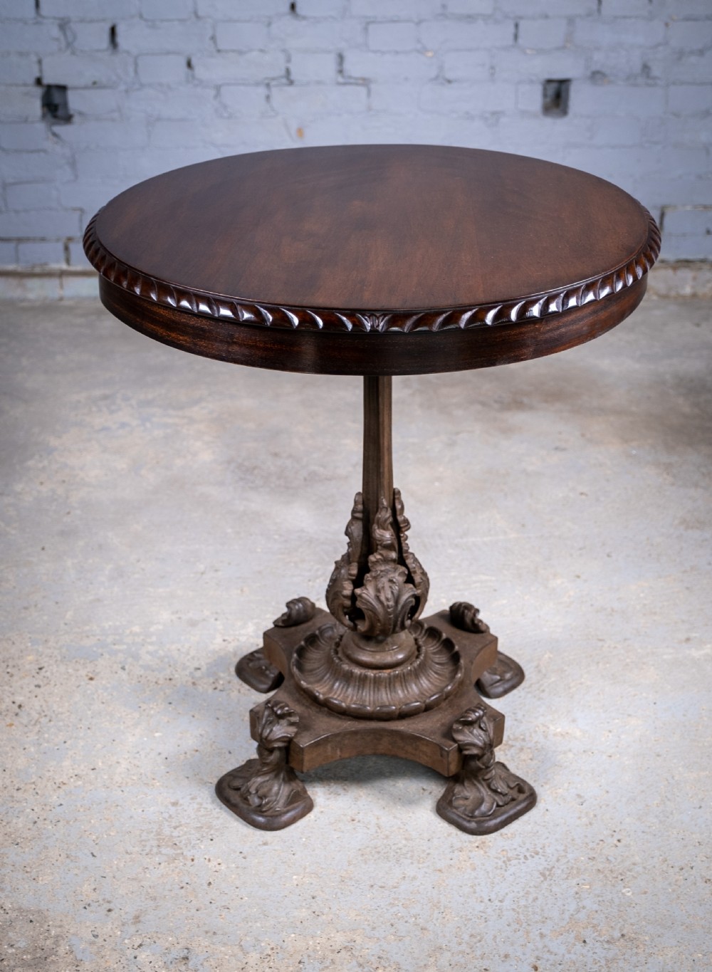 19th Century Cast Iron Tilt Table With Later Flame Mahogany Top.
