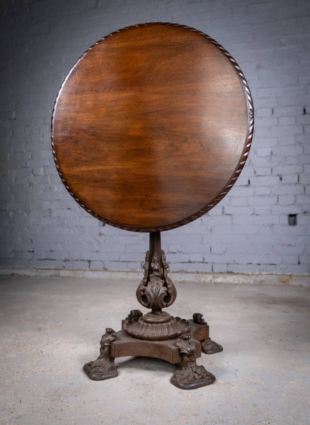 19th Century Cast Iron Tilt Table With Later Flame Mahogany Top. View IX