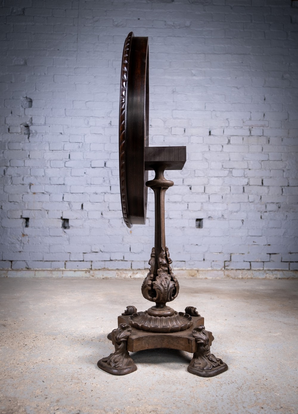 19th Century Cast Iron Tilt Table With Later Flame Mahogany Top. View XI