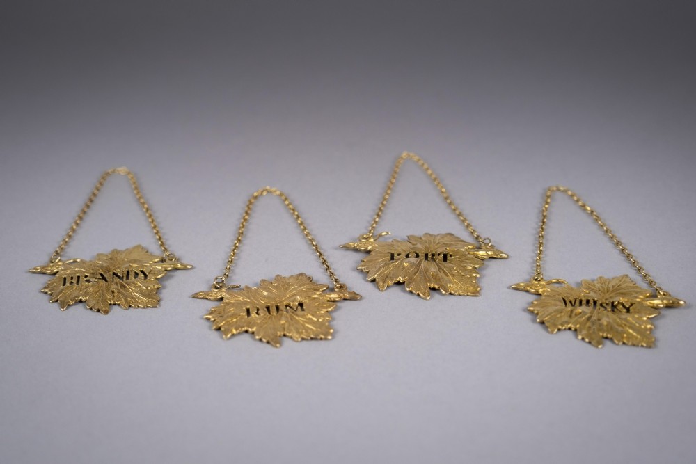 Four Silver Gilt Vine Leaf Decanter Labels by SMD, London, 1968. View IV