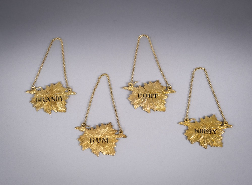 Four Silver Gilt Vine Leaf Decanter Labels by SMD, London, 1968. View V