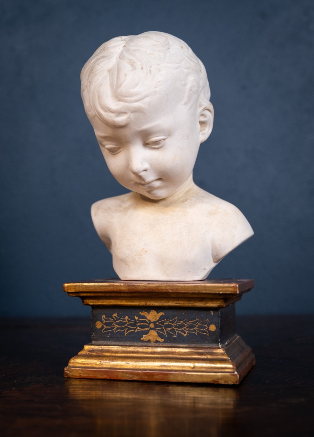 Plaster Bust Of Infant On Giltwood Plinth