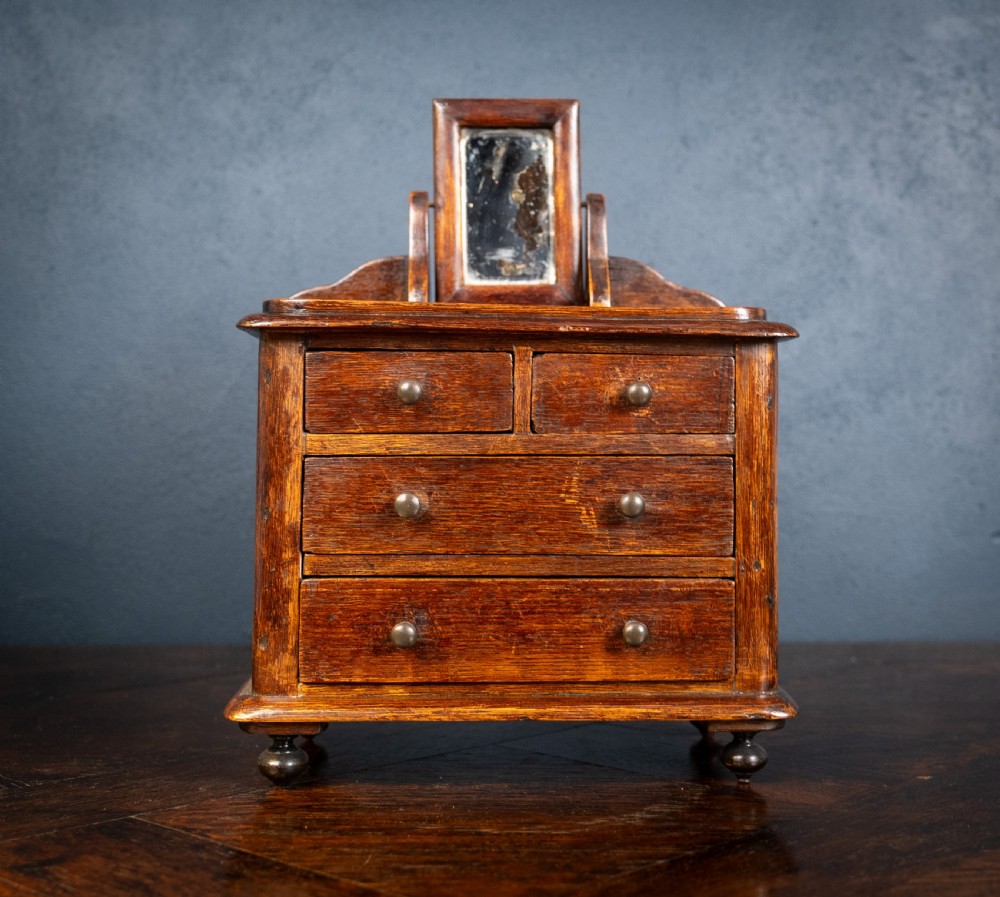 Miniature Early 19th Century Oak Chest Of Drawers With Swing Mirror