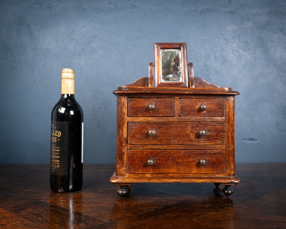 Miniature Early 19th Century Oak Chest Of Drawers With Swing Mirror View II